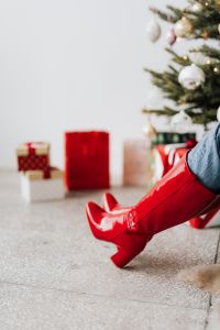 Kaboompics - Red Boot Detail beside Christmas Gifts and Tree