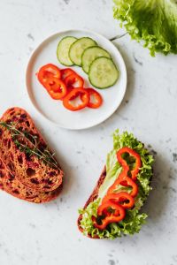 Kaboompics - Minimal Vegetable Sandwich Flat Lay with Cucumber and Red Pepper