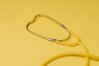 Kaboompics - Minimal Yellow Stethoscope Flat Lay, Medical Care Background with Copy Space