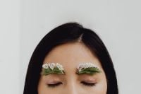 Kaboompics - Eyes-Closed Beauty Portrait with Twin White Floral Eyebrows and Greenery