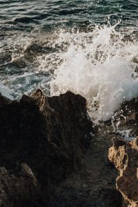 Kaboompics - White Surf Bursting Between Coastal Rocks
