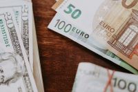 Kaboompics - Polish Zloty, US Dollars and Euro Banknotes on Wood, Close-Up Mixed Currency