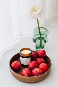 Kaboompics - Candle in a jar - plums - furniture