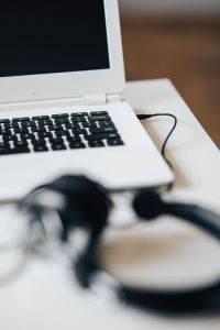 Kaboompics - White laptop with smartphone and headphones