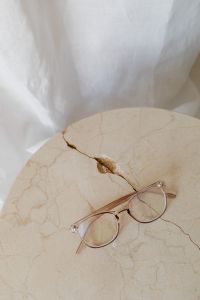 Kaboompics - Close-Up Rose Gold Eyeglasses on Cracked Marble Table