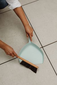 Kaboompics - Dustpan and Brush on Tiled Floor Near Indoor Plants