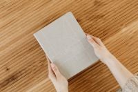 Kaboompics - Hands Holding a Gray Bullet Journal Notebook
