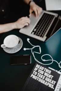 Home Office Lifestyle: Man Working from Home with a Laptop and Coffee