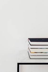 Kaboompics - Stack of Books on Marble Table with White Copy Space