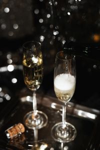 Kaboompics - Pouring Champagne With Festive Bokeh