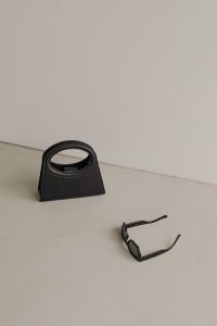 Kaboompics - Black Handbag, Espresso and Sunglasses on Neutral Background