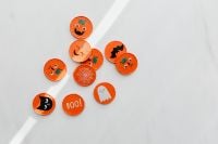 Kaboompics - Orange Halloween Buttons and Party Props Flat Lay