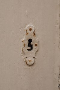 Kaboompics - Antique Keyhole Escutcheon on Textured Plaster Wall