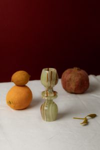 Kaboompics - Citrus and Pomegranate with Vintage Green Glass Candlestick