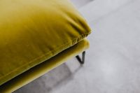Kaboompics - Olive Green Sofa Cushion Seam and Black Metal Support Leg, Close-Up