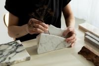 Kaboompics - Creative Hands Arranging Marble and Stone Swatches