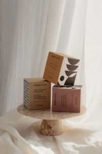 Kaboompics - Candle Packaging Mockup on a Stone Pedestal