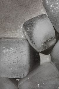 Kaboompics - Extreme Close-Up of Overlapping Ice Cubes with Water Droplets, Abstract Chilled Drink Texture