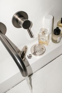 Kaboompics - UGC-Style Flash Photo of Bathroom Products and Sink Faucet