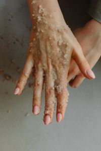Kaboompics - Close-Up of Hand Covered in Coarse Sea Salt Body Scrub after Exfoliation