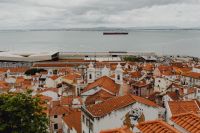 Kaboompics - Lisbon Rooftops and the Tagus River with a Boat on the Water