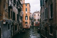Kaboompics - Gondolas on a Shadowed Venice Canal Between Historic Buildings