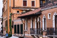 Kaboompics - Brick and Coral Venetian Facades with Gothic Arched Windows