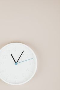 Kaboompics - Minimal White Clock with Beige Copy Space
