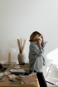 Kaboompics - Designer Taking a Phone Call in a Bright Interior Design Workspace