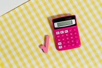 Kaboompics - Pink Calculator With a Square Root Symbol on Yellow Gingham
