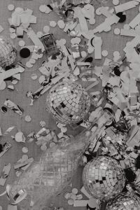 Kaboompics - Silver Disco Balls, Confetti and Champagne Bottle for New Year's Eve