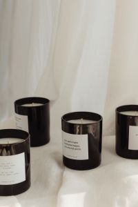 Kaboompics - Neutral Candle Packaging on White Fabric