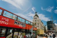 Kaboompics - Madrid City Tour Bus Passing the Metropolis Building on Gran Vía