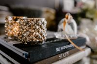 Kaboompics - Crystal Candle Holder and Glass Decanter on Interior Design Books