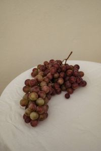 Kaboompics - Red and Green Grapes with Wine Glass on Table