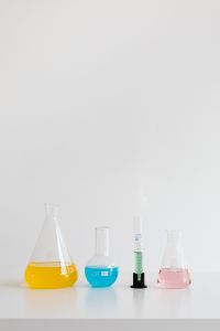 Kaboompics - Colorful Chemistry Flasks Along a White Background