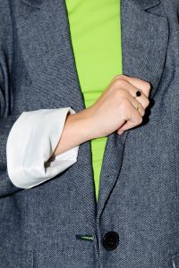 Kaboompics - Person in Gray Blazer Adjusting a Lime Green Top