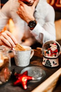 Drinking coffee with milk and cookies in a holiday mood
