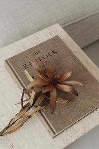 Kaboompics - Overhead Kinfolk Book Flat Lay with Dried Protea on Travertine