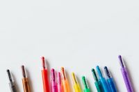 Kaboompics - Scattered Colored Crayons on White with Generous Copy Space for Art and School Branding