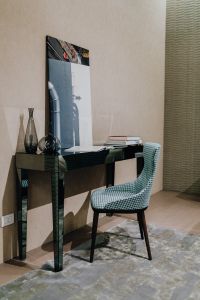 Kaboompics - Mirrored Console Desk with Glass Vases, Books and Patterned Chair