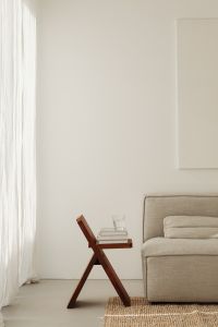 Cozy Neutral Living Room with Gray Sofa, Books, Candles and Black Pampas Grass