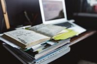 Kaboompics - Stack of Books and Desk Organizers on a Dark Office Desk