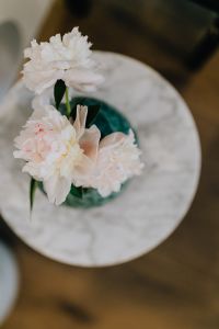 Kaboompics - Peony flowers in vase on marble table