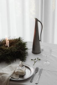 Minimal White Christmas Dinner Table with Advent Wreath, Panettone and Neutral Place Settings