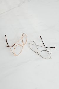 Kaboompics - Gold And Silver Eyeglasses Arranged On White Marble