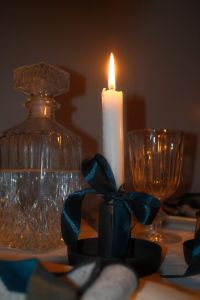 Kaboompics - Crystal Decanter and Candle with Teal Bow
