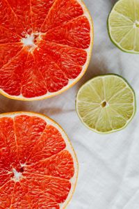Kaboompics - Grapefruit Halves with Open Linen Space for Fresh Recipe Layouts