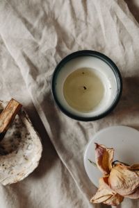 Kaboompics - Overhead Unlit Candle With Burnt Palo Santo And Dried Petals