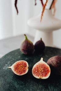 Kaboompics - Halved And Whole Figs On Green Marble Table